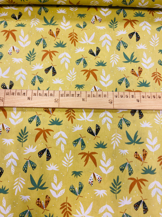 Image with 100% cotton fabric - leaves on a yellow-green background 125 g/m² – available at Šarlotes audumi