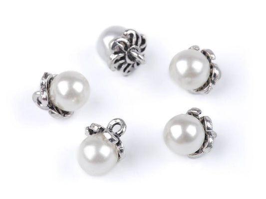 alt
Image with buttons with a pearlescent sheen and metal edge | Ø9 mm | assorted shades – available at Charlotte's fabrics