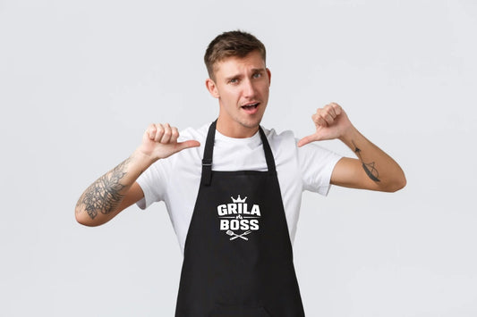 Image with black apron "Grill Boss" – available at Charlotte's Fabrics