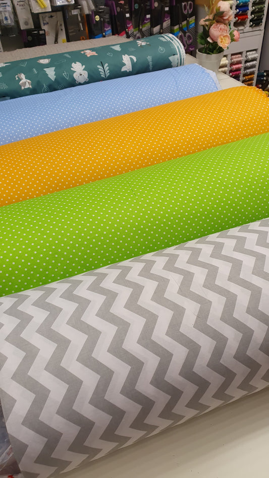 100% Cotton fabric - white polka dots on a green background (4 mm) 130 g/m²