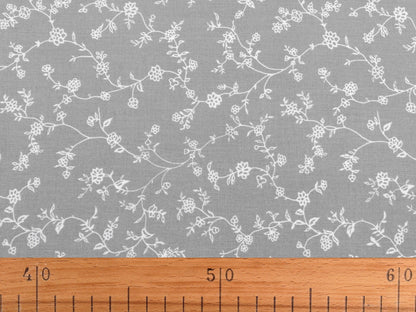 Image with 100% cotton fabric - white flowering stems on red 125 g/m² – available at Šarlotes Audumi