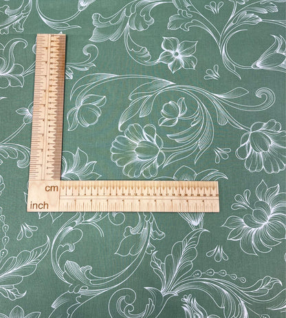 Image with 100% cotton fabric - white floral shadows on green 125 g/m² – available at Šarlotes audumi