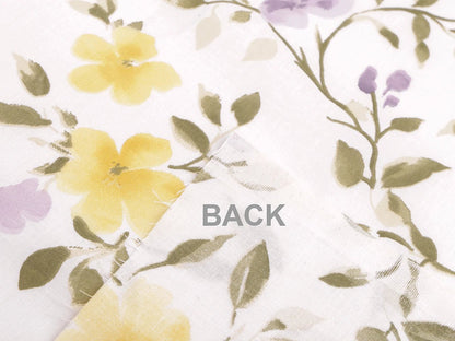 Image of 100% cotton fabric with yellow and lilac flowers – available online at Šarlotes audumi