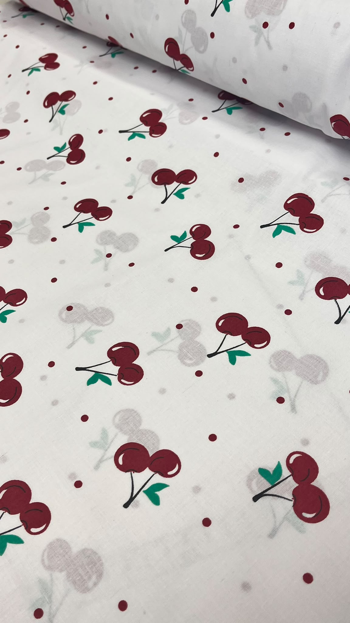 Image of 100% cotton cherry print fabric – available online at Šarlotes audumi