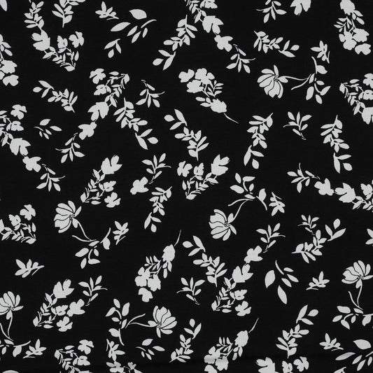 100% Viscose fabric - white flowers on a black background 110 g/m²