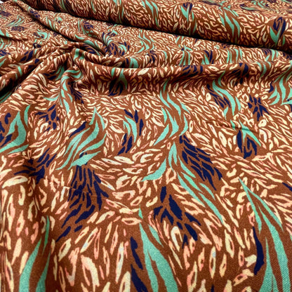 100% viscose fabric, brownish with mint pattern 125 g/m²