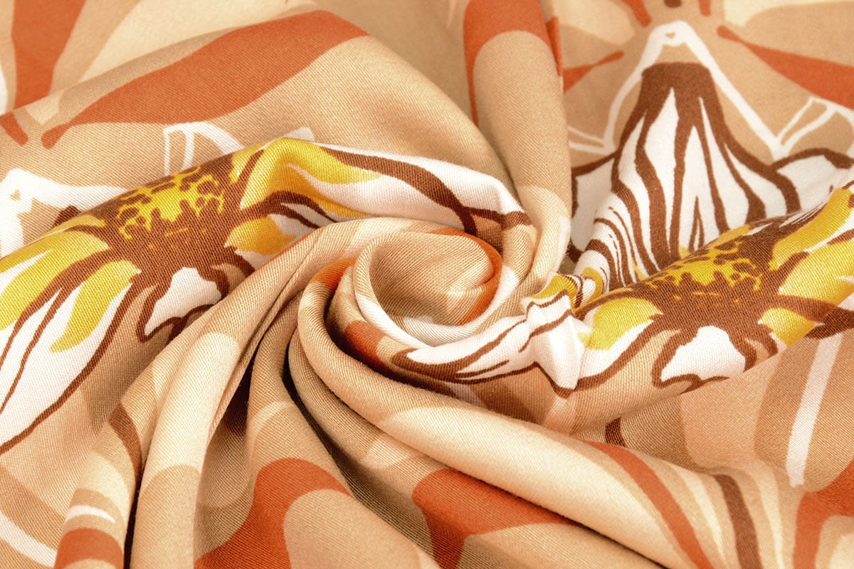 100% viscose fabric - orange flowers 100 g/m²