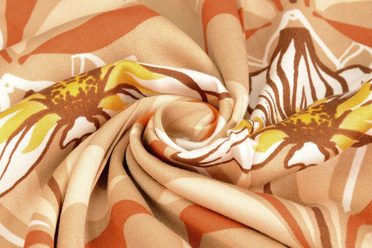 100% viscose fabric - orange flowers 100 g/m²