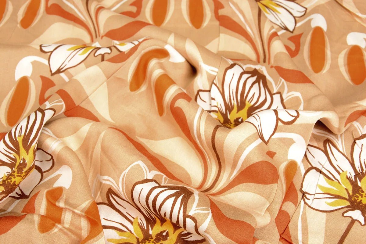 100% viscose fabric - orange flowers 100 g/m²
