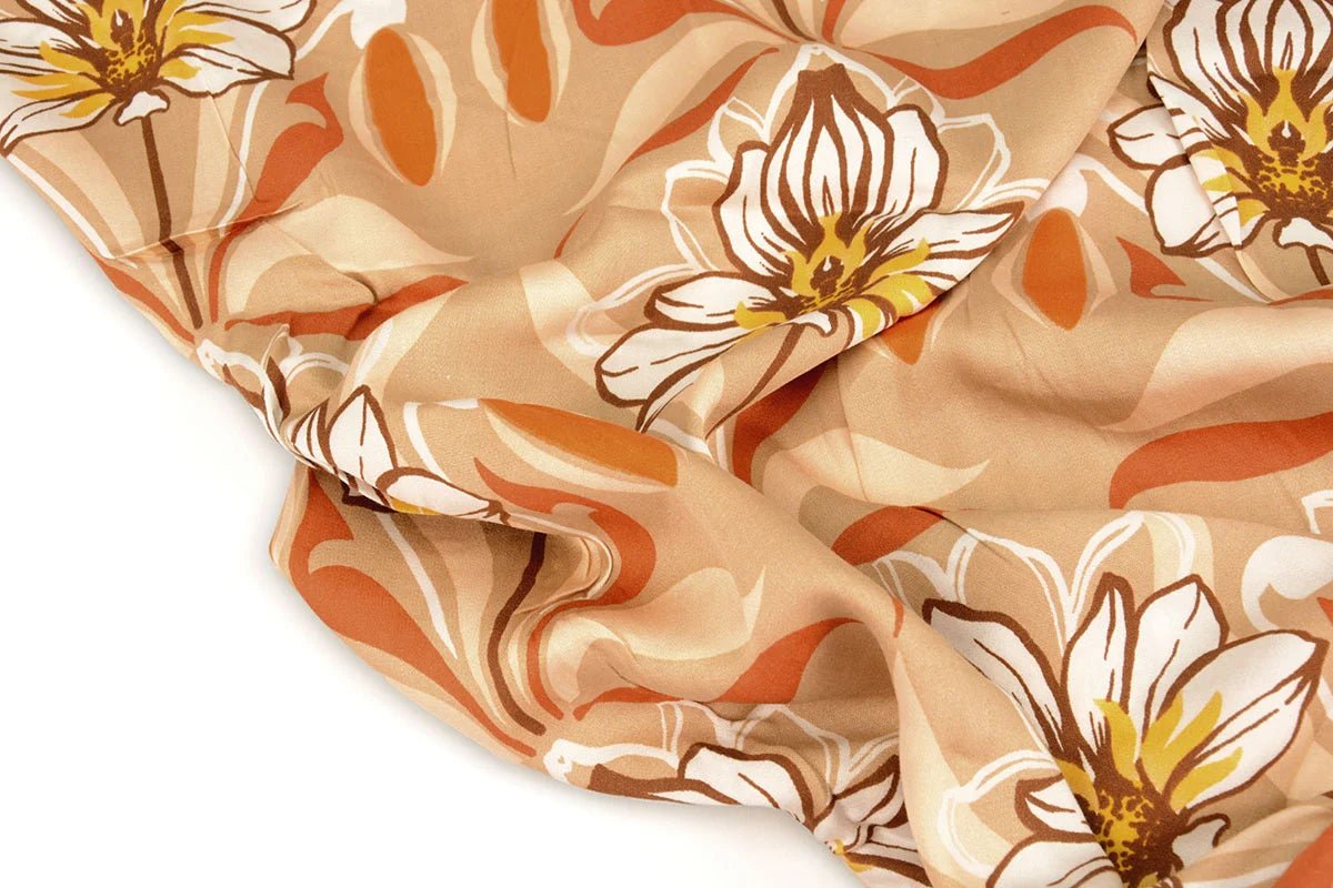 100% viscose fabric - orange flowers 100 g/m²
