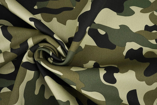 Image of denim fabric with camouflage pattern – Army Green 275 g/m² – available at Šarlotes audumi