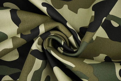 Image of denim fabric with camouflage pattern – Army Green 275 g/m² – available at Šarlotes audumi