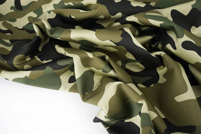 Image with denim fabric with camouflage pattern – Army Green 275 g/m² – available at Šarlotes audumi