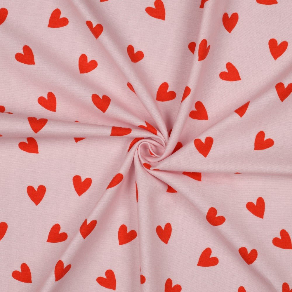 Image with Flannel - red hearts on pink 165 g/m² – available at Charlotte’s Fabrics