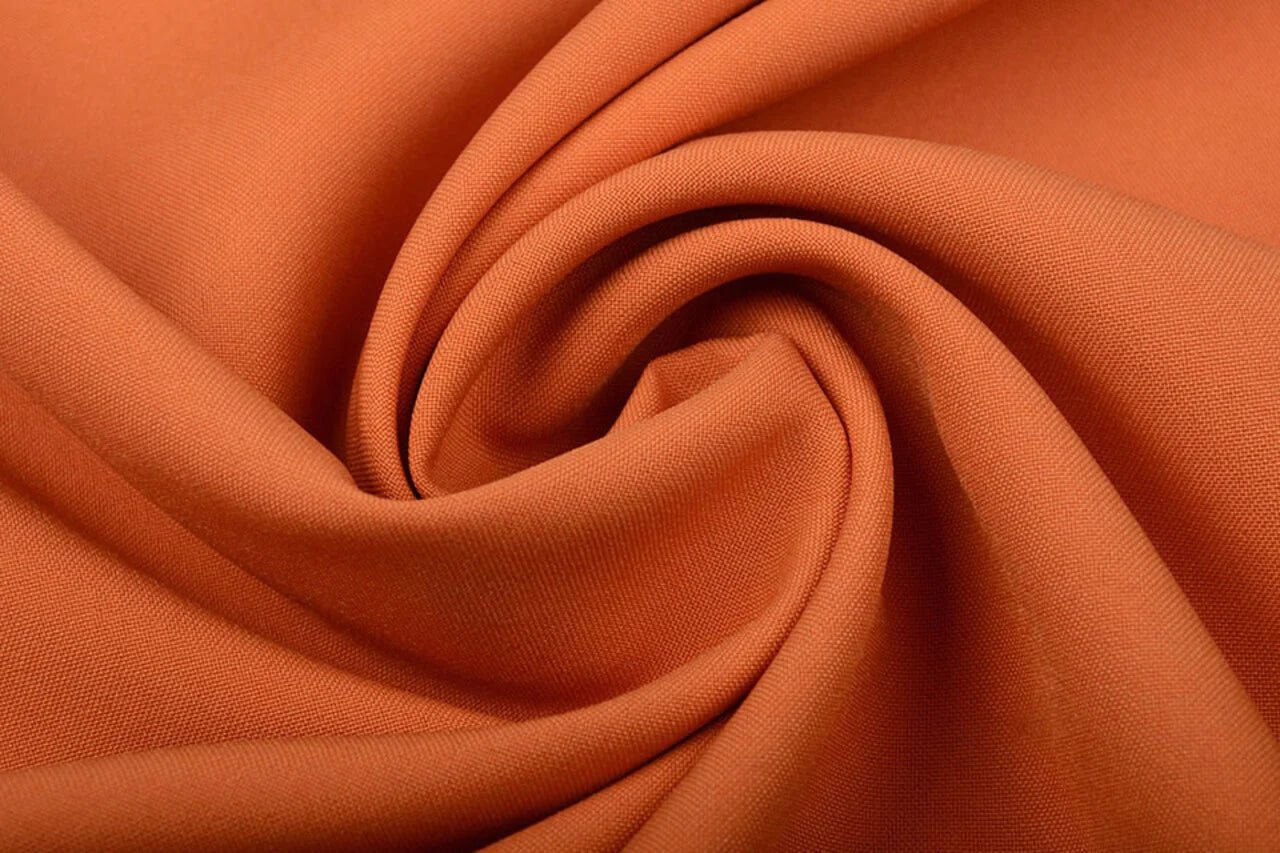 Image of orange gabardine available online at Šarlotes audumi