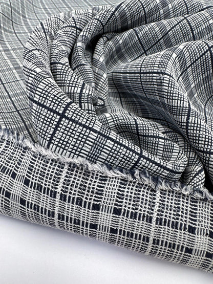 Image of Italian 100% cotton fabric in gray with a check pattern, medium-weight fabric for clothing, 195 g/m² – available at Šarlote Fabrics