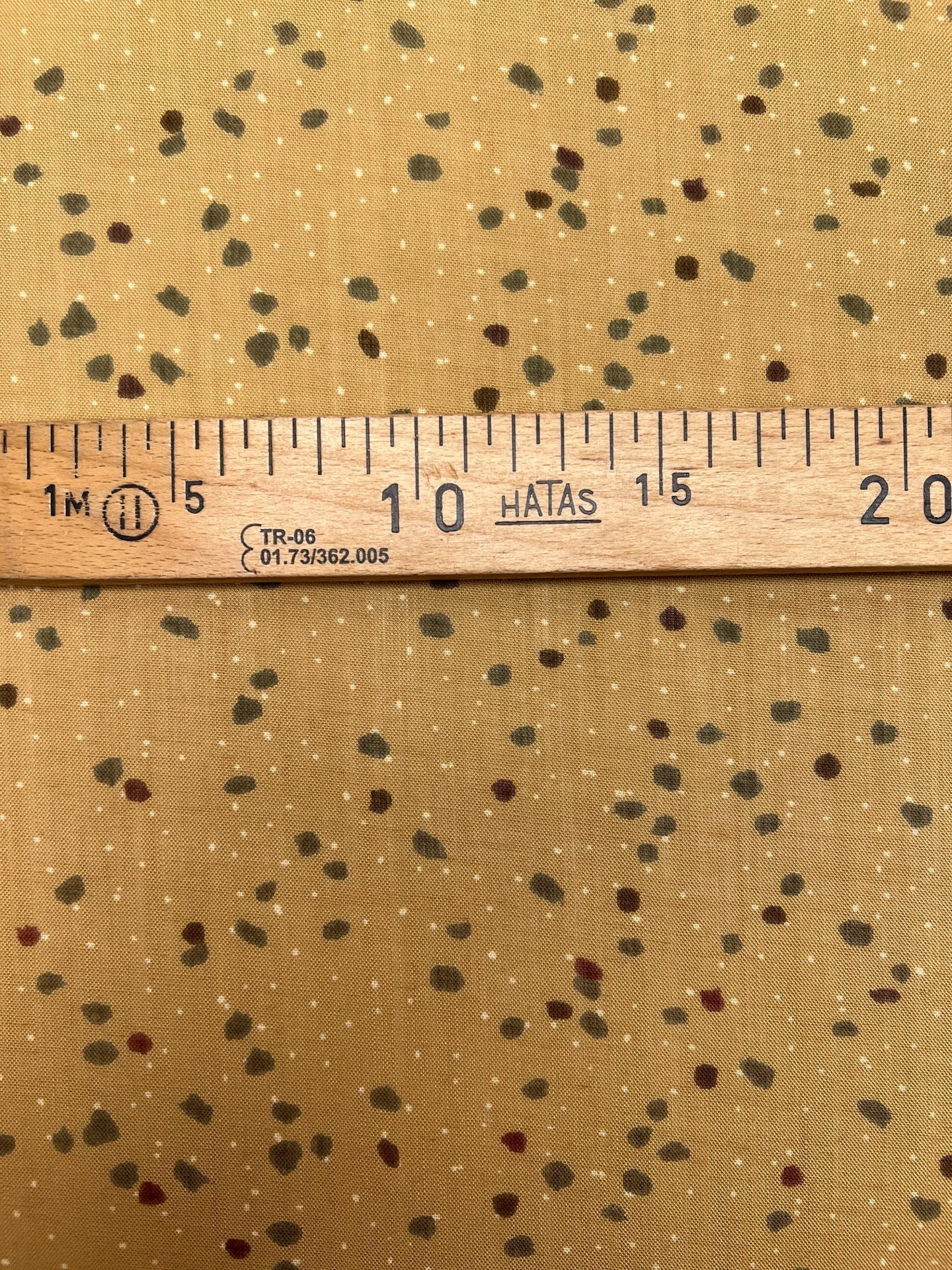 Image of Italian acrylic fabric with a beige and brown dot pattern – available online at Charlotte's Fabrics