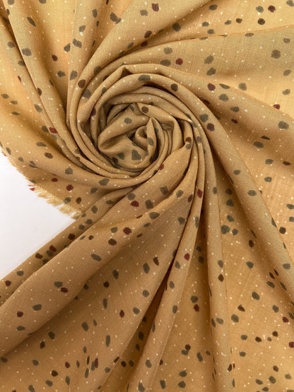 Image of Italian acrylic fabric with a beige and brown polka dot pattern – available online at Šarlotes audumi