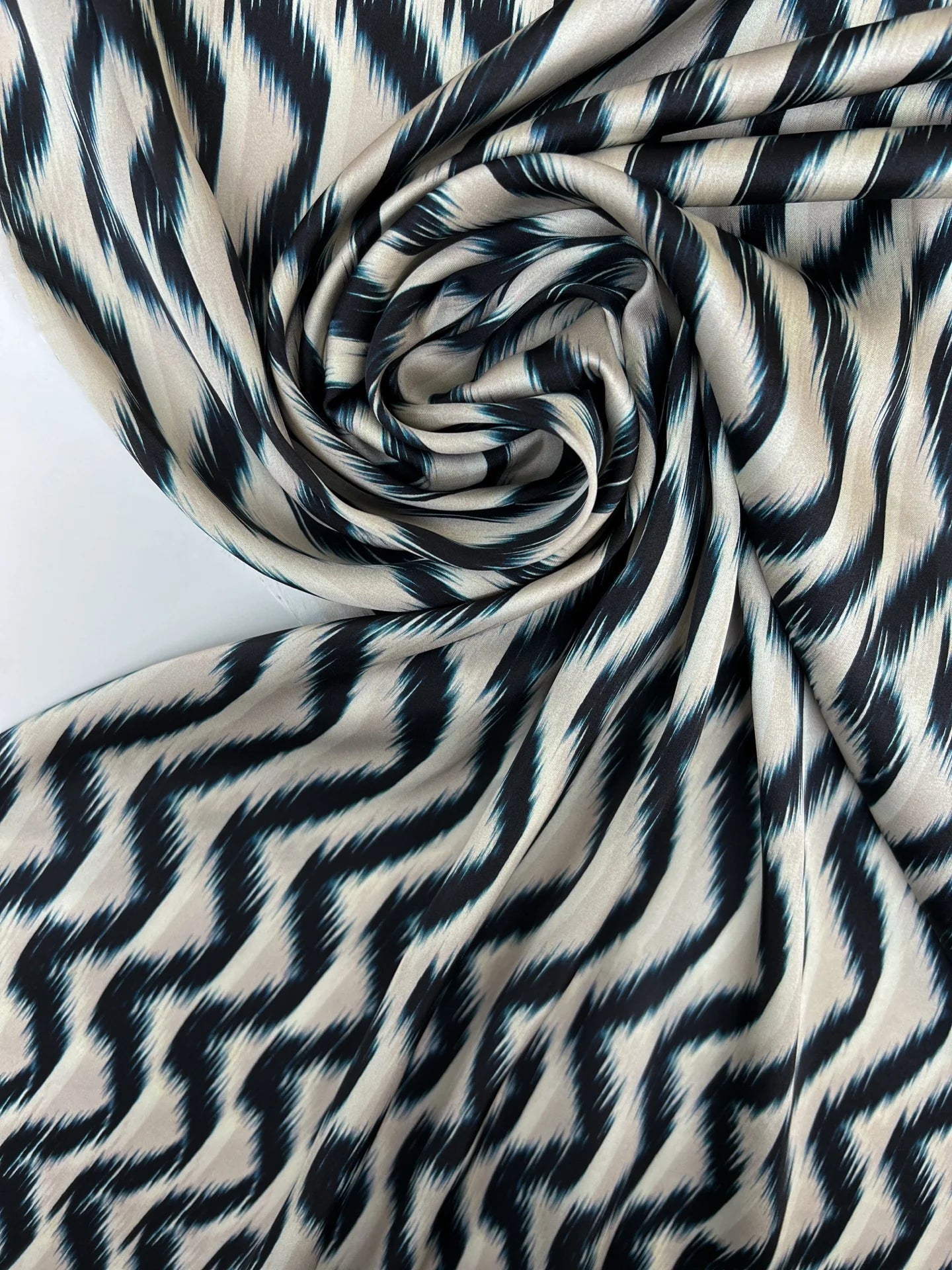 Image of Italian satin fabric, beige-blue with an abstract pattern, 85 g/m2 – available at Šarlotes audumi