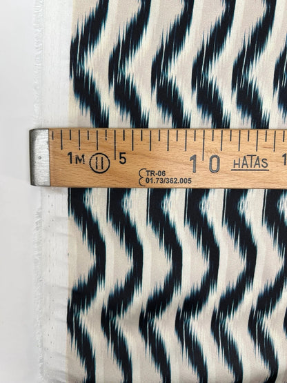 Image of Italian satin fabric in beige and blue with an abstract pattern 85 g/m2 – available at Šarlotes audumi