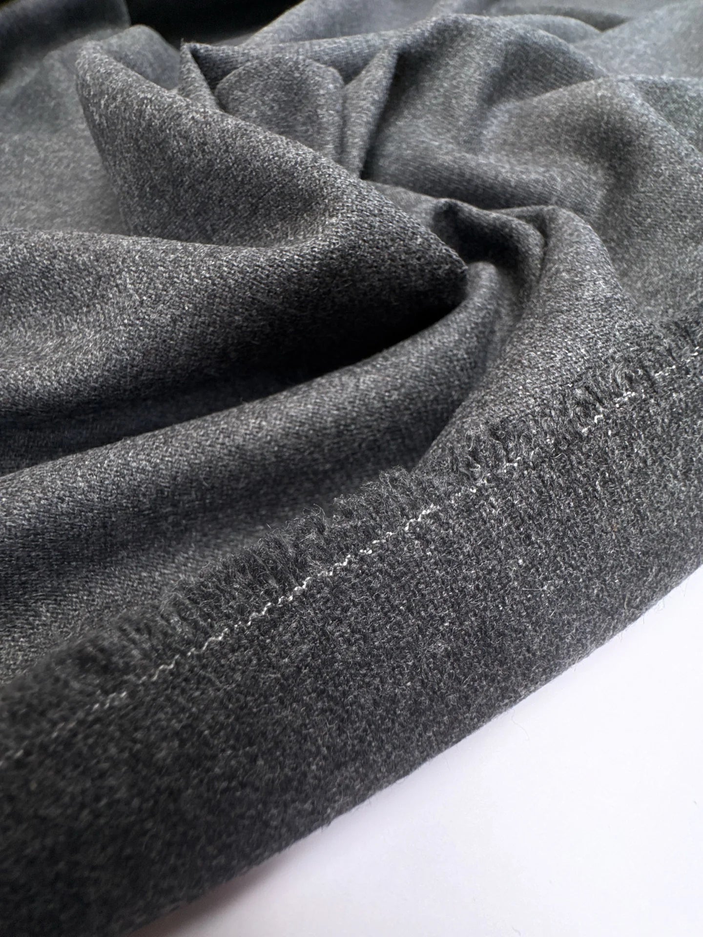 Image of Italian wool fabric in gray with a twill weave, a heavier fabric for suits and outerwear, 275 g m2 – available at Šarlotes audumi