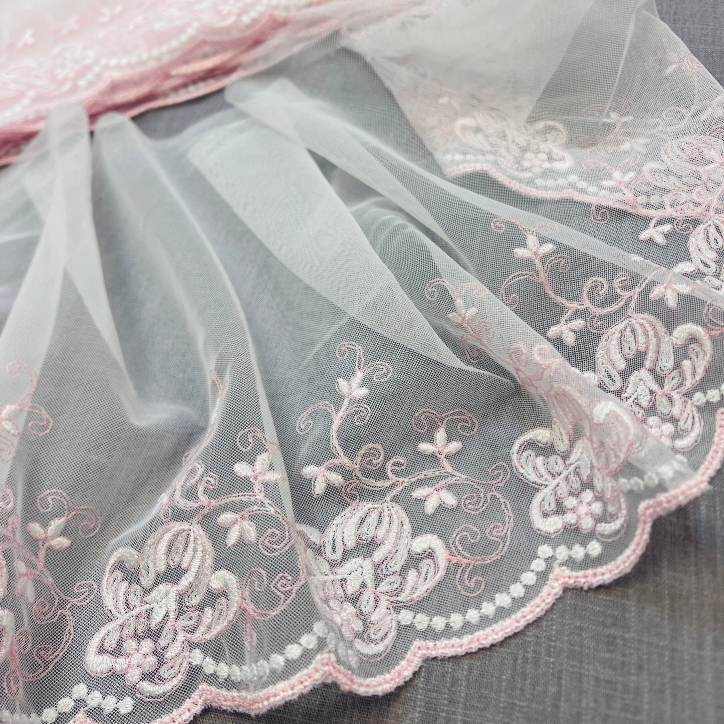 Image of embroidered lace 20 cm - with pink-toned embroidery – available at Šarlotes audumi