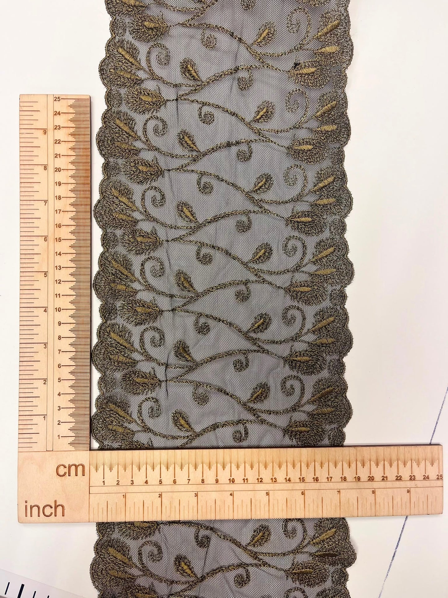 Image of embroidered lace on tulle, 19 cm, black with gold accents – available online at Šarlotes audumi