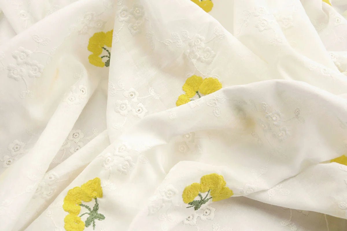 Embroidered cotton fabric - yellow flowers 110 g/m²