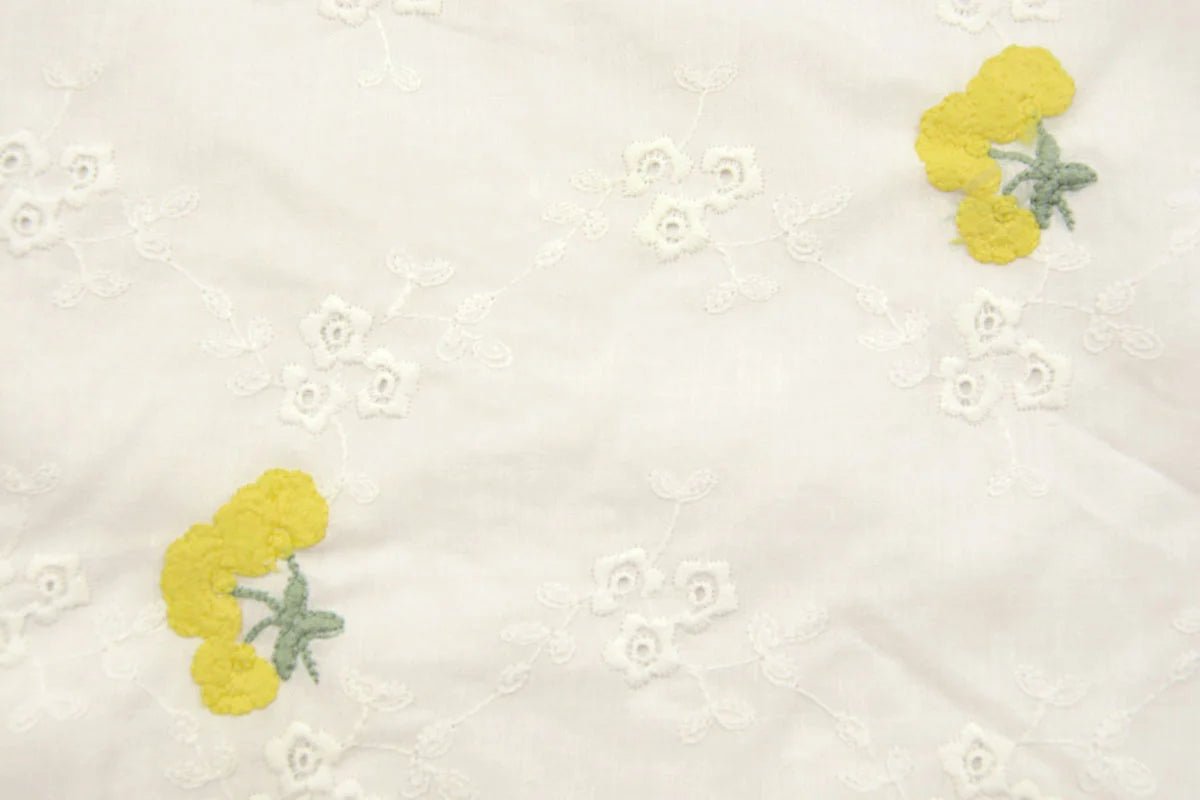 Embroidered cotton fabric - yellow flowers 110 g/m²