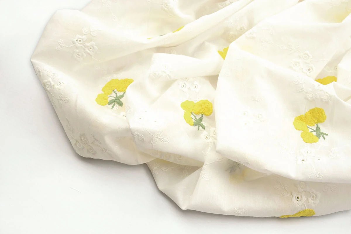 Embroidered cotton fabric - yellow flowers 110 g/m²
