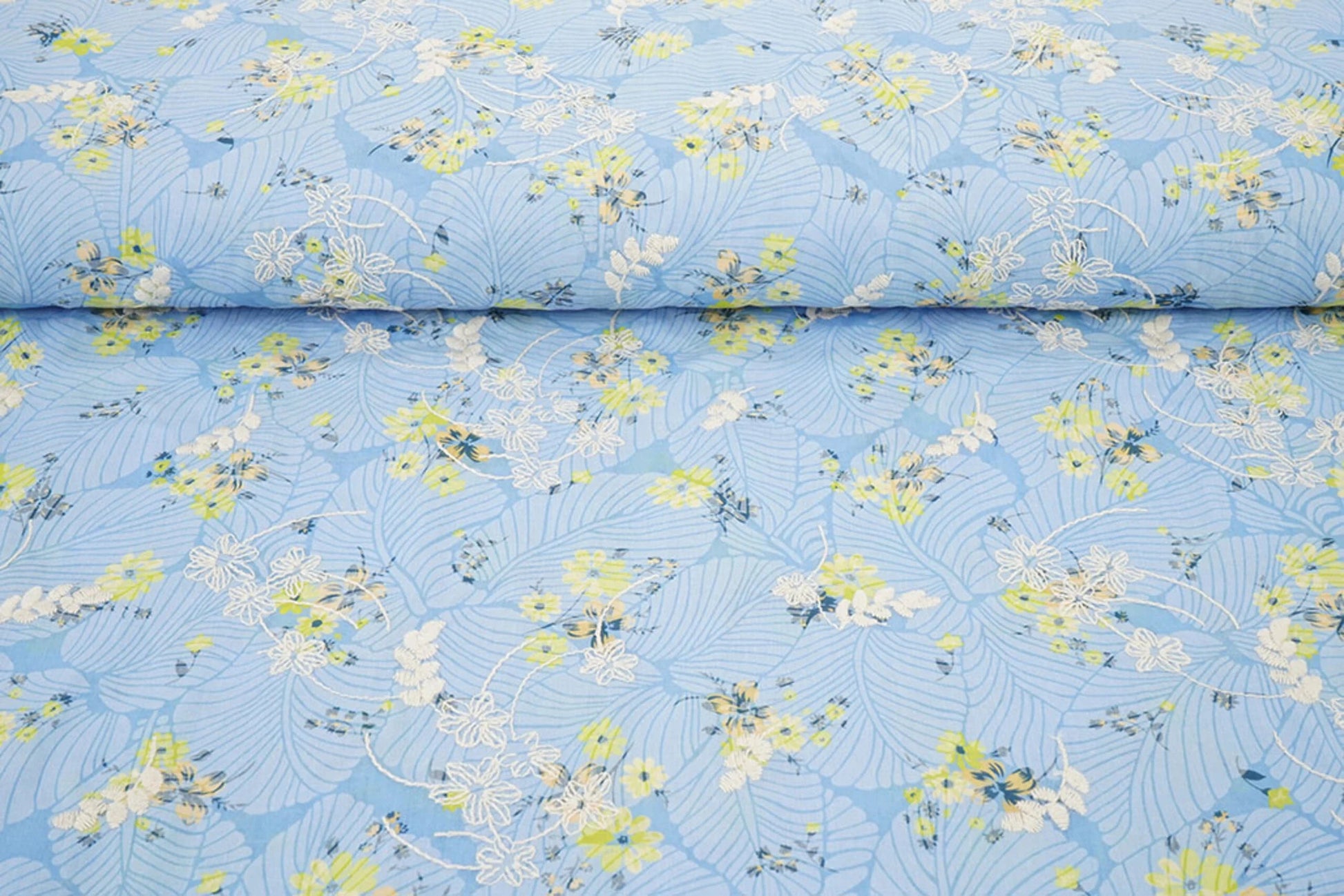 Image of embroidered cotton fabric - yellow flowers on blue 115 g/m² – available at Šarlotes audumi