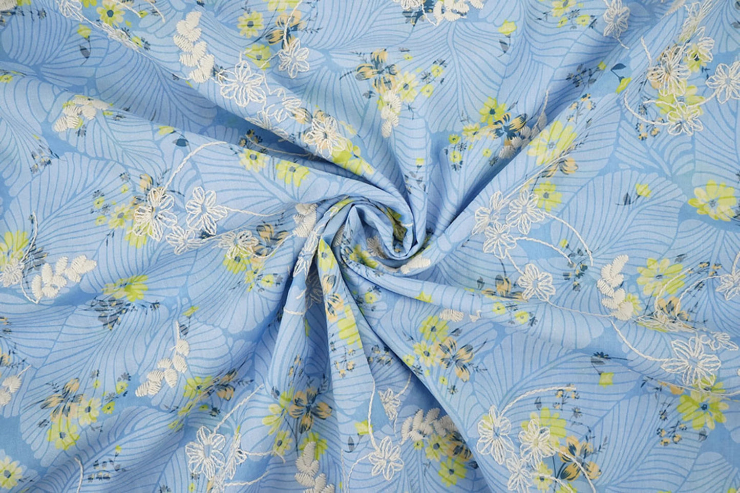 Image of embroidered cotton fabric - yellow flowers on blue 115 g/m² – available at Šarlotes audumi