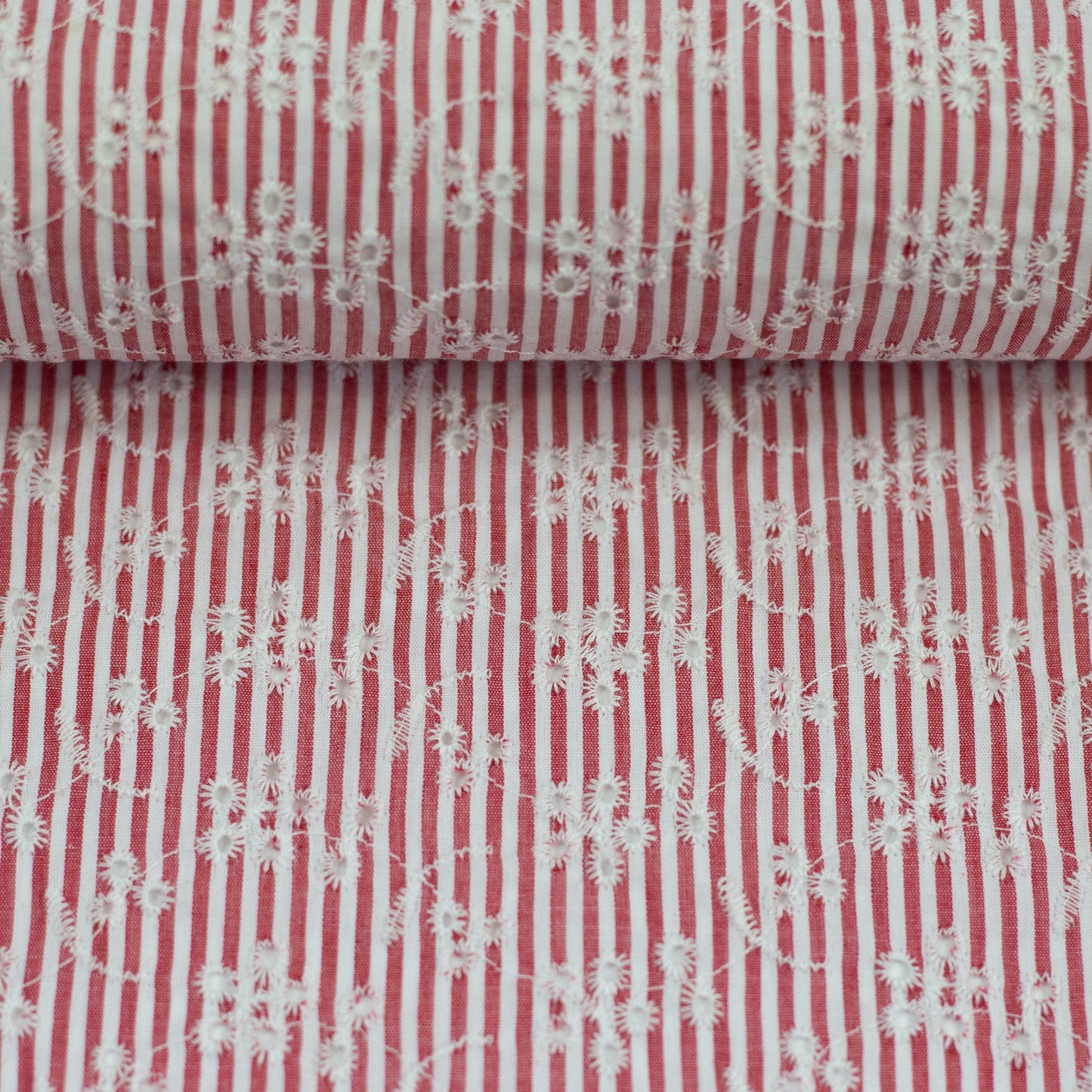 Image of embroidered cotton fabric - floral motif with lines 120 g/m² – available at Šarlotes audumi