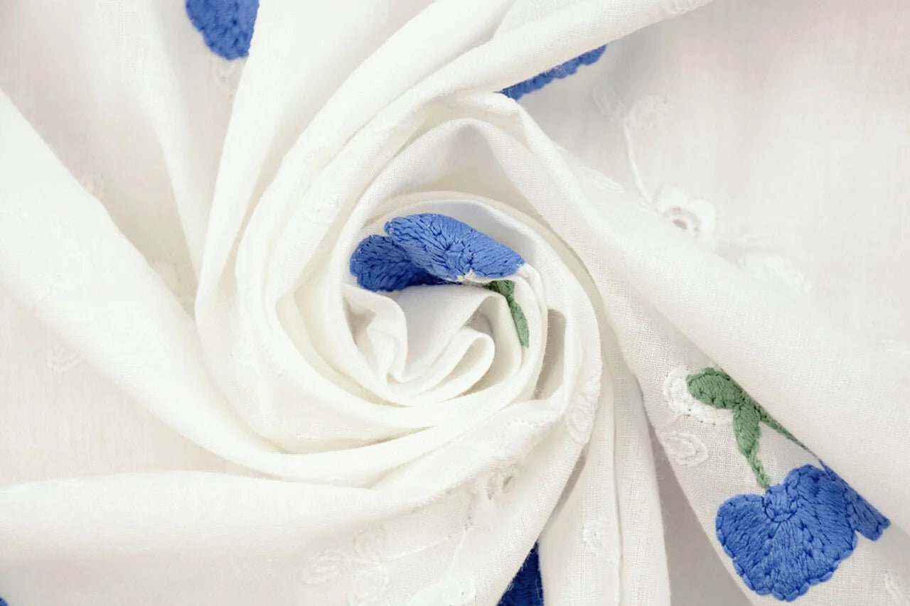 Embroidered cotton fabric - blue flowers 110 g/m²
