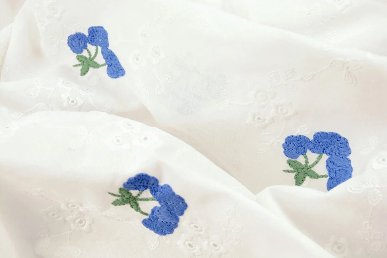 Embroidered cotton fabric - blue flowers 110 g/m²