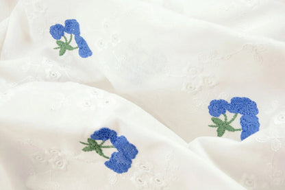 Embroidered cotton fabric - blue flowers 110 g/m²