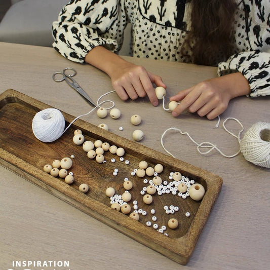 Image of a wooden bead set in a box – available at Charlotte's Fabrics