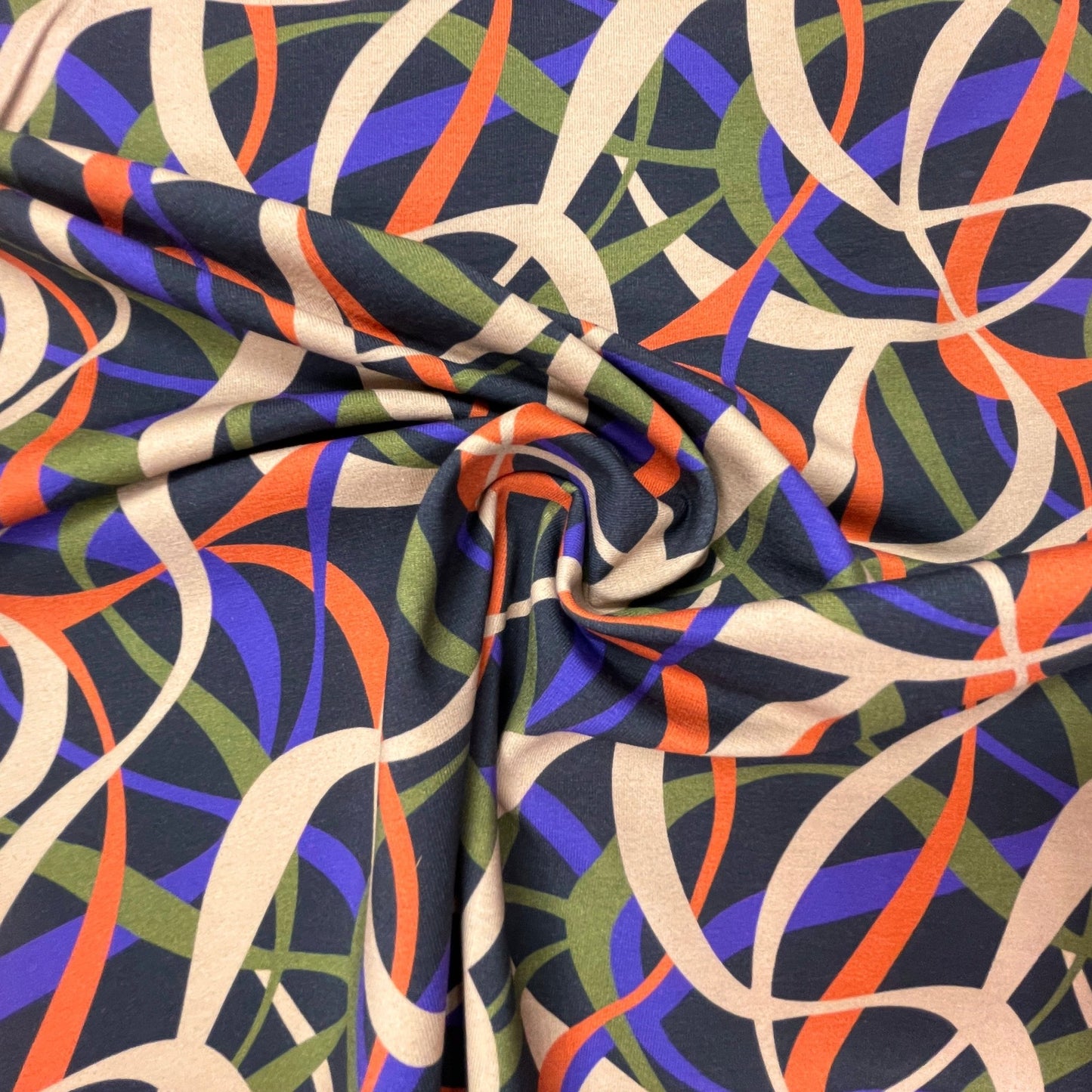 Cotton loopback knit - beige, lilac, orange, green motif 250 g/m²