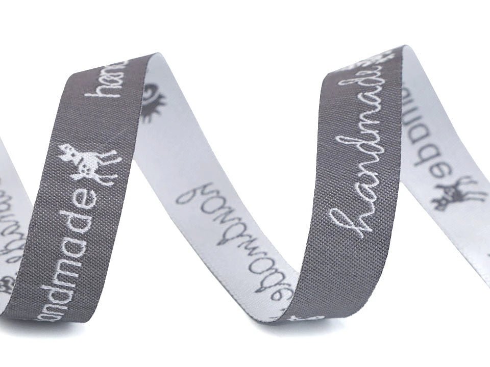 Image of cotton ribbon with the inscription Hand made | 16 mm, 9 m – available at Šarlotes audumi