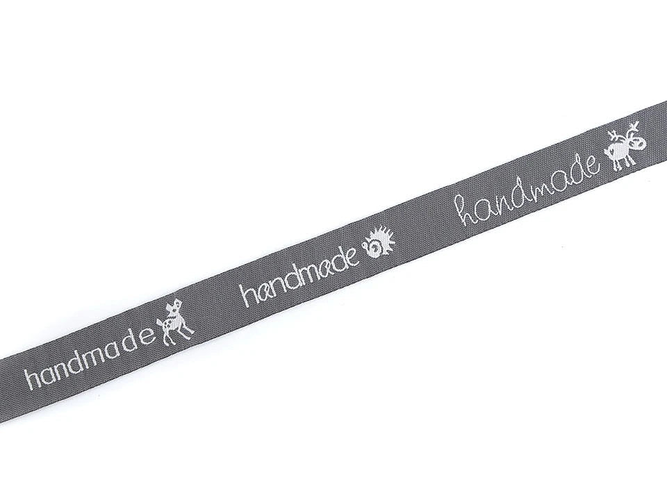 Image of cotton ribbon with Hand made inscription | 16 mm, 9 m – available at Charlotte’s Fabrics