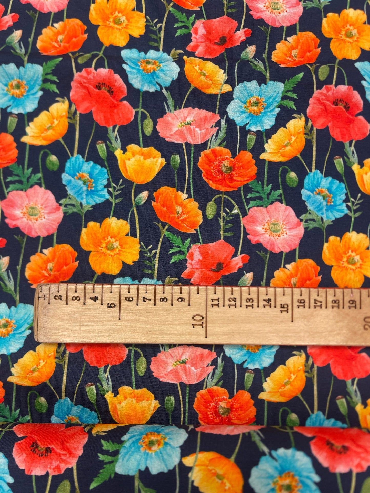 Cotton knit fabric - colorful poppies on a dark blue background 250 g/m²