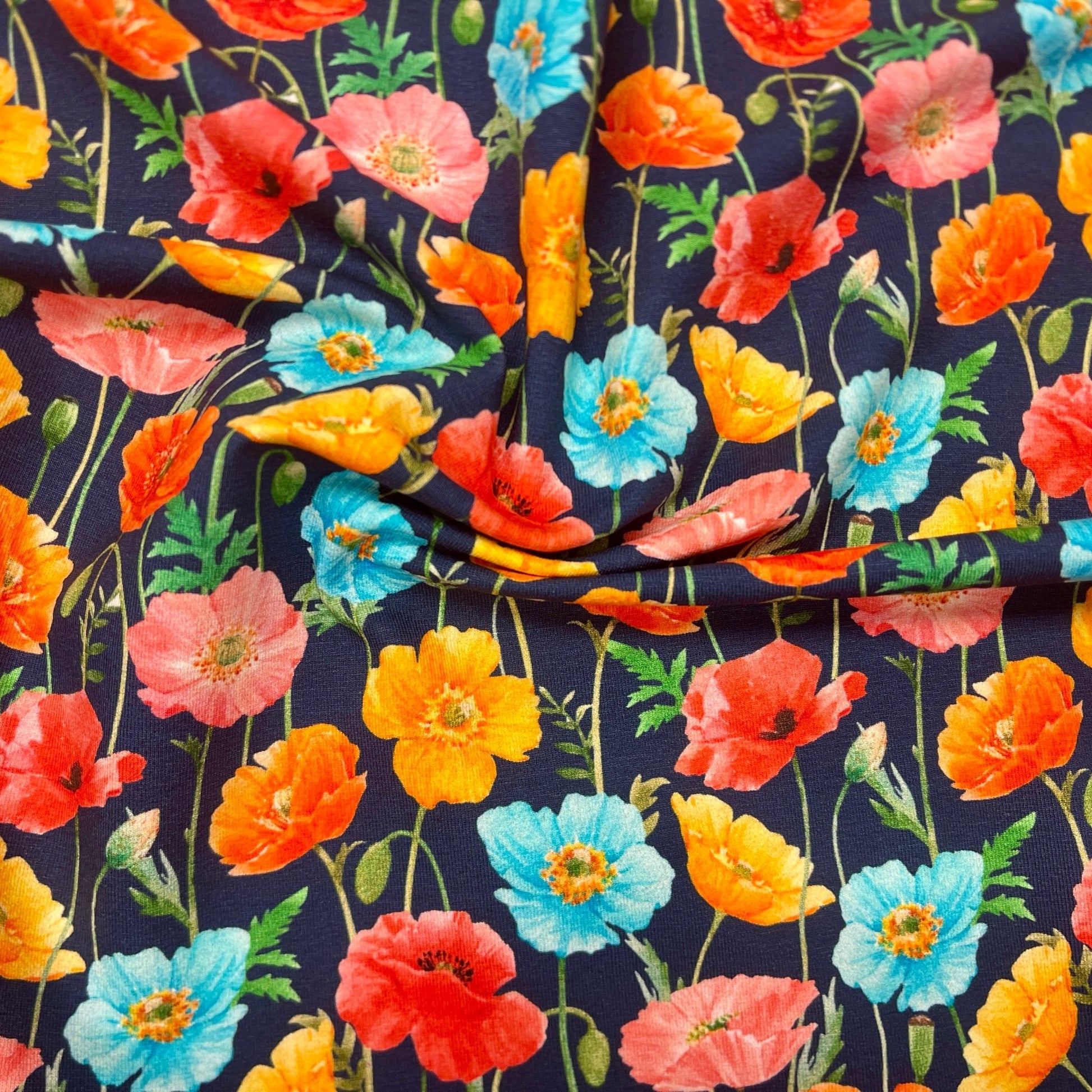 Cotton knit fabric - colorful poppies on a dark blue background 250 g/m²