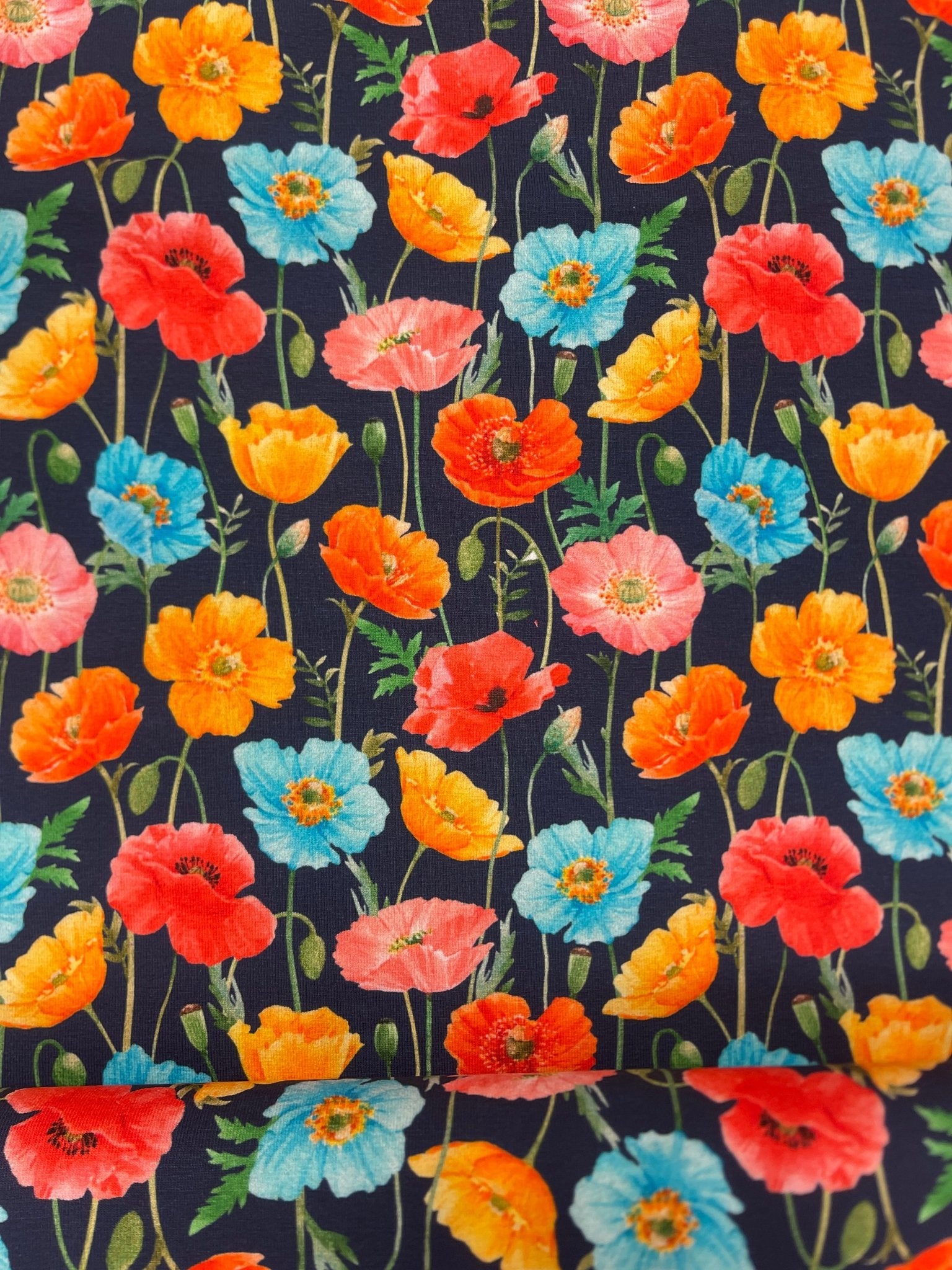 Cotton knit fabric - colorful poppies on a dark blue background 250 g/m²