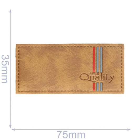 Image of faux leather label "Quality", brown, 75 × 35 mm – available at Šarlotes audumi