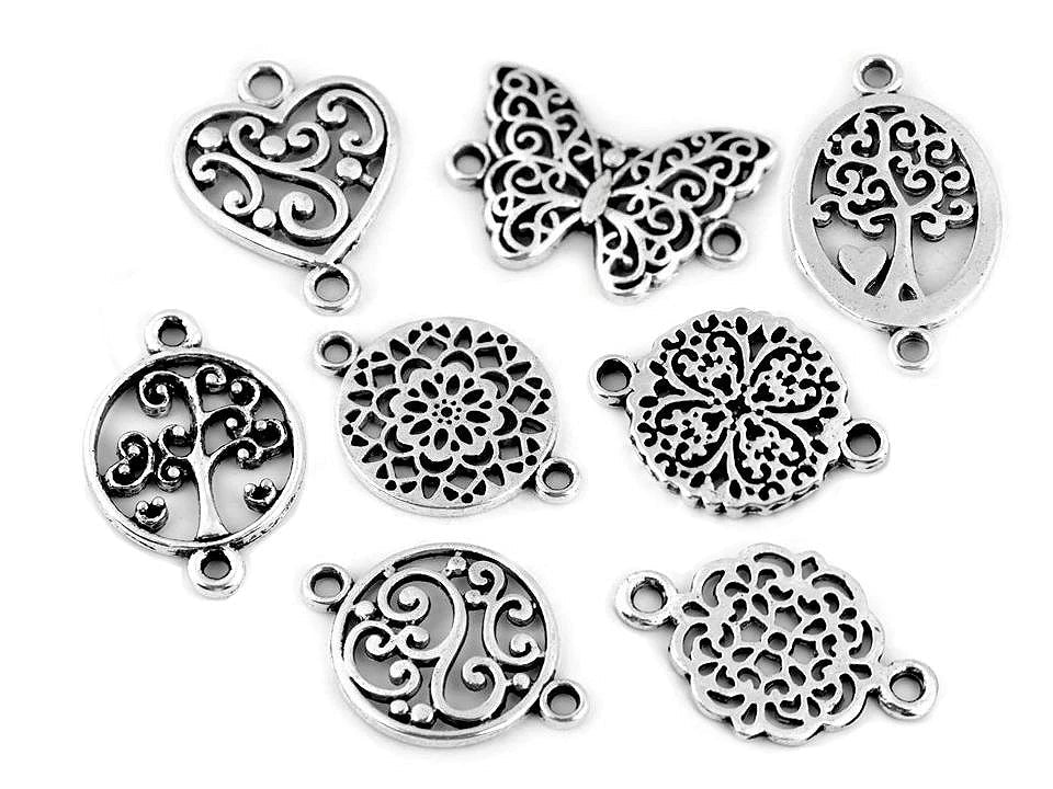 Image of a metal pendant – Butterfly, Mandala, Heart, Tree of Life – available at Charlotte's Fabrics