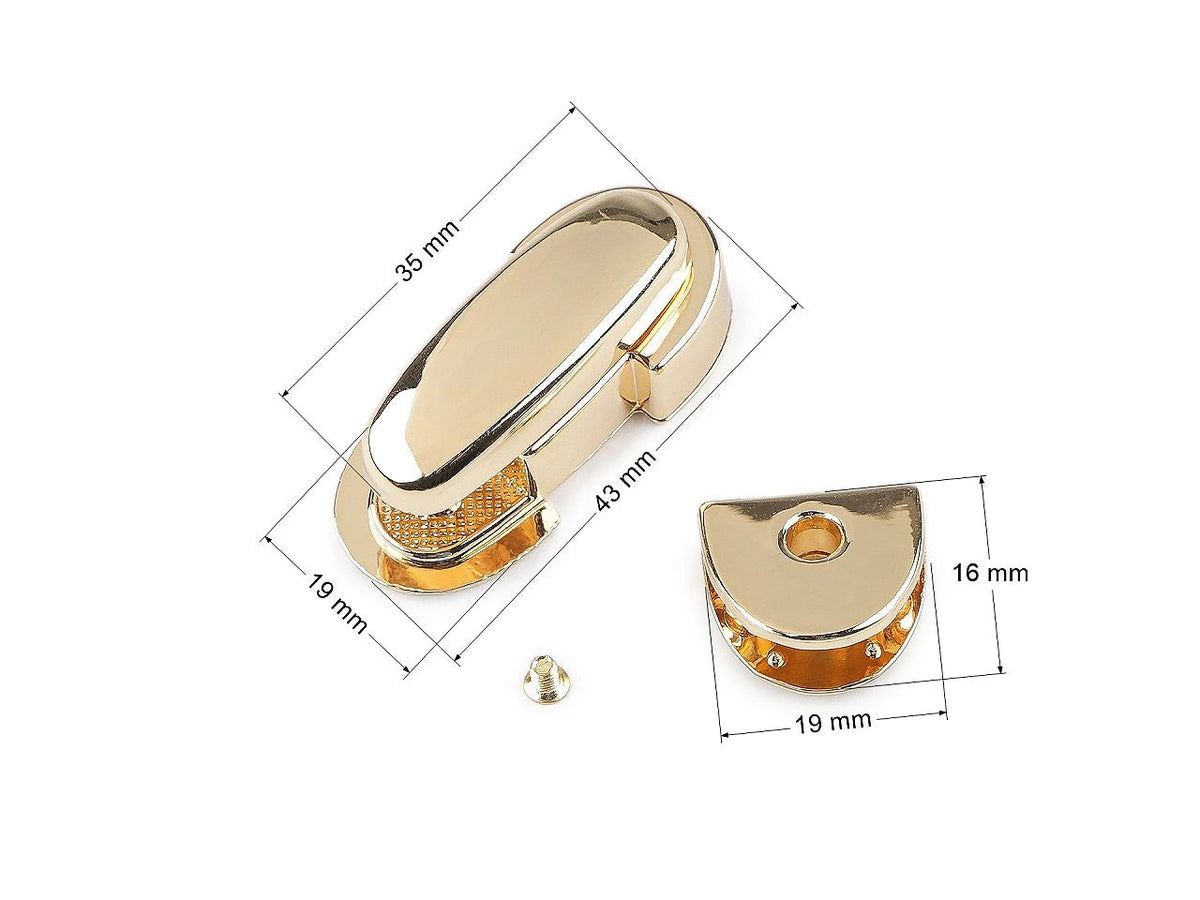 Zdjęcie przedstawia metalowe zapięcie / zamek do torebki 19 × 43 mm – dostępne online w Šarlotes audumi