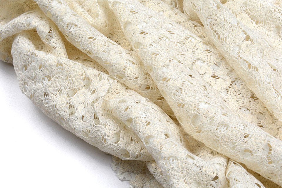 Lace fabric - milky white with gold accents 170 g/m²