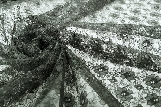 Fine lace fabric - black flowers 75 g/m²