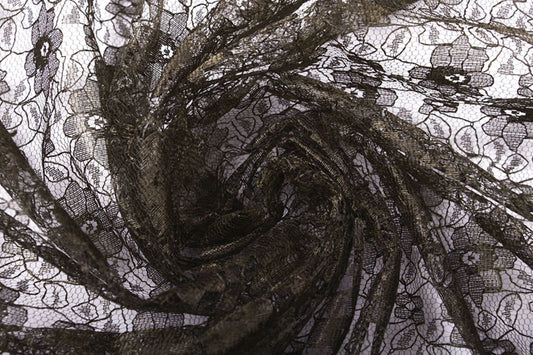 Image with delicate lace fabric - chocolate brown flowers 75 g/m² – available at Charlotte Fabrics