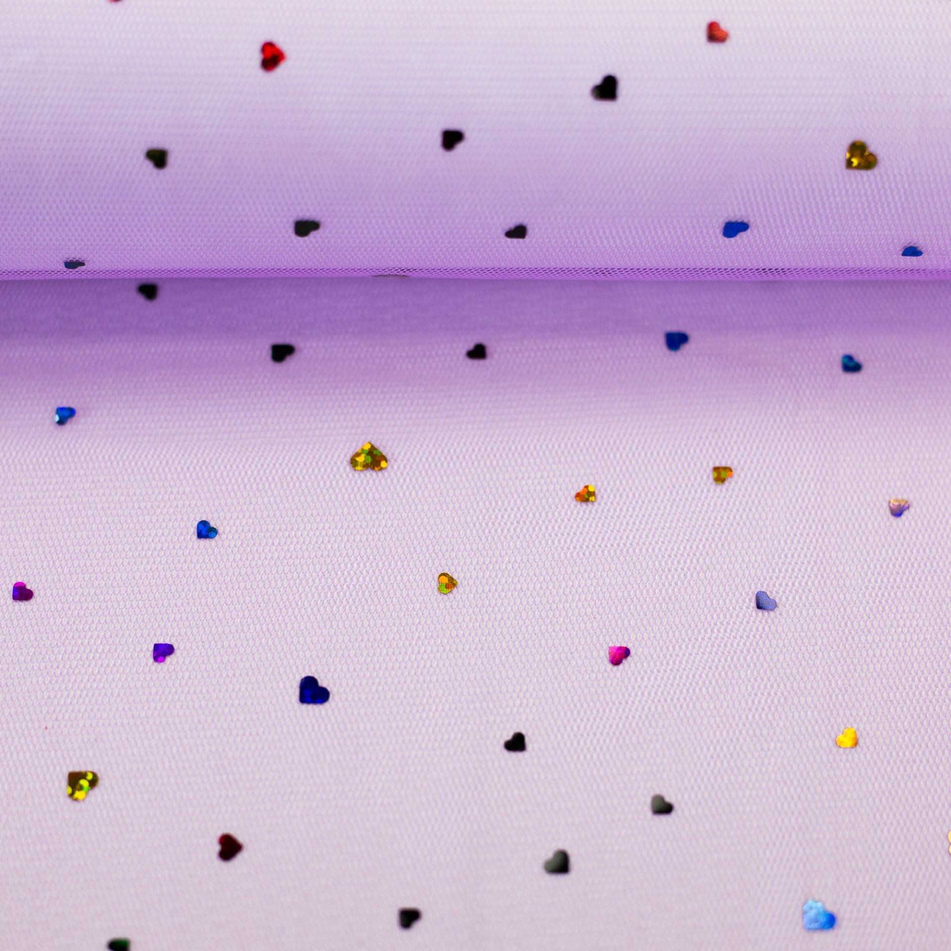 Image with soft tulle with hearts on a lilac background 40 g/m² – available at Šarlotes audumi